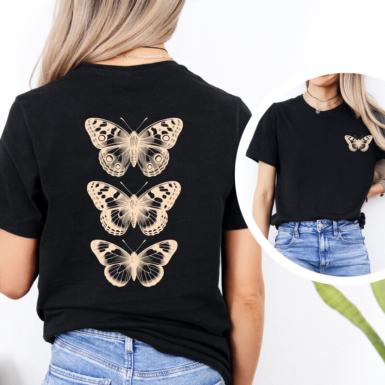 A woman wearing a black t-shirt with three printed butterflies on the back.