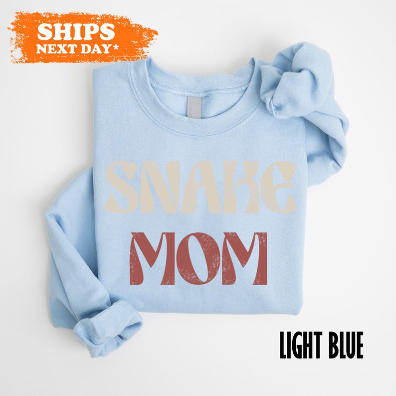 a blue shirt with the words snarke mom printed on it