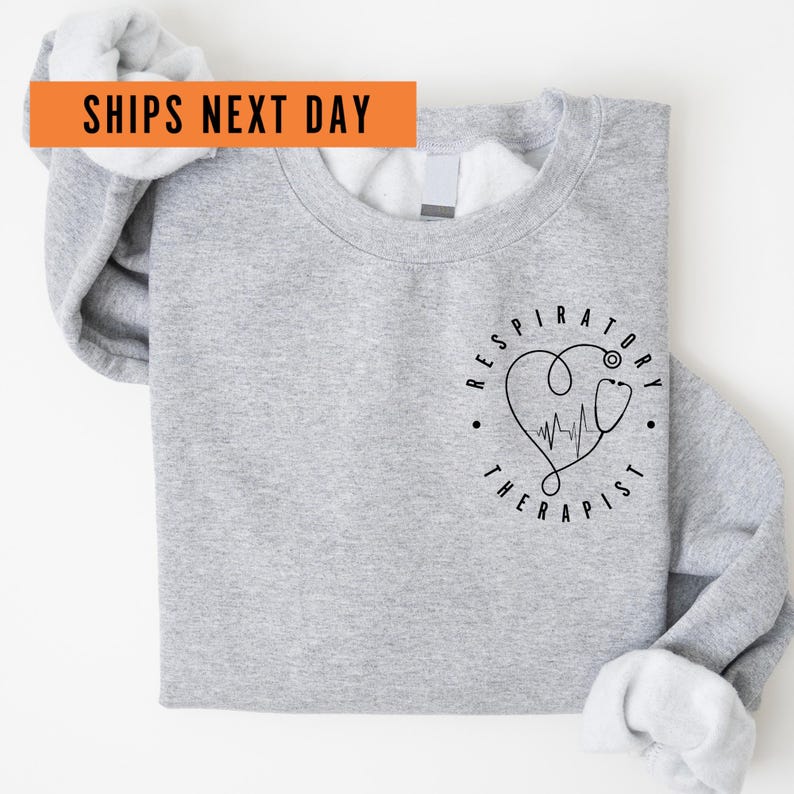 a gray shirt with a heart on it