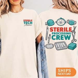 May include: A cream-colored t-shirt featuring a small front graphic that reads STERILE TECH Anna in red and teal. The back displays a large graphic with the text STERILE PROCESSING CREW surrounded by illustrations of surgical tools, a tray, and a mask.