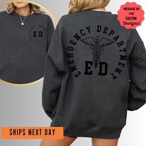 a woman wearing a sweatshirt with a cadel on it