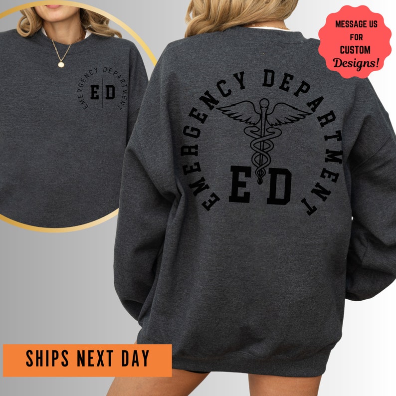 a woman wearing a sweatshirt with a cadel on it