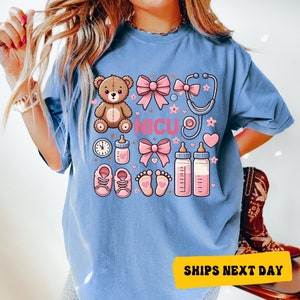 a woman wearing a blue tshirt with a teddy bear on it