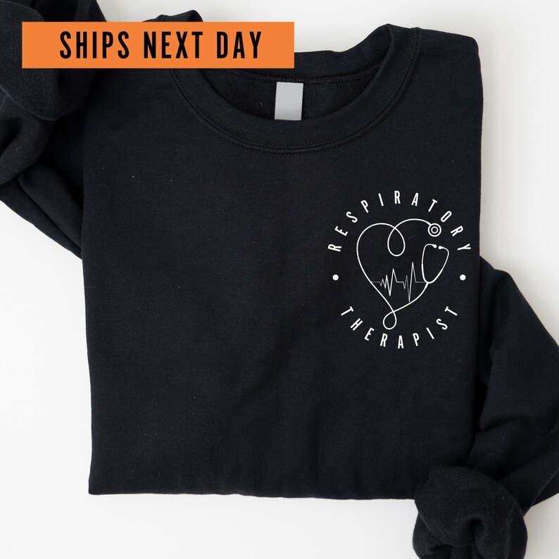 a black shirt with a heart and heartbeat on it