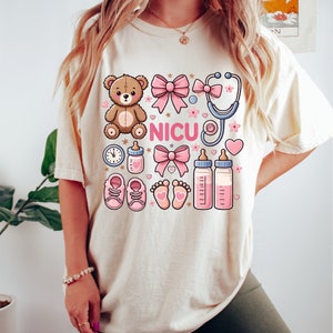 a woman wearing a t - shirt with a teddy bear on it