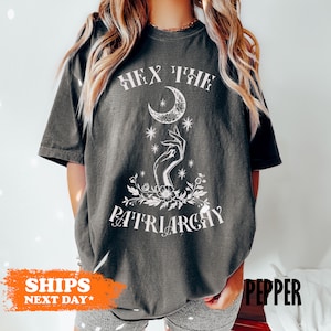 a woman wearing a t - shirt that says fix the pittilargy