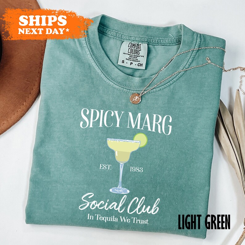 a t - shirt that says spicy marg on it