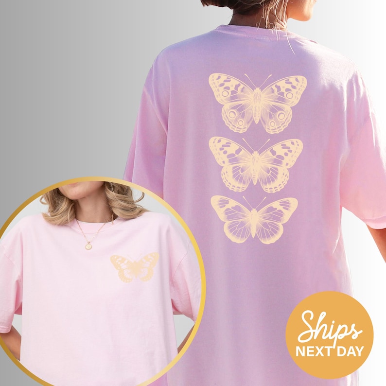 a woman wearing a pink t-shirt with three butterflies printed on the back.