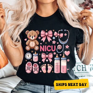 a woman with blonde hair wearing a black t - shirt that says nicu