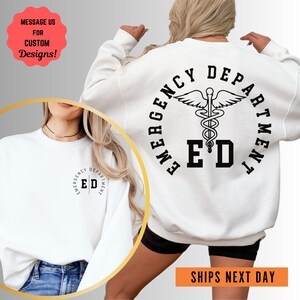 a woman wearing a white sweatshirt with the words emergency department printed on it