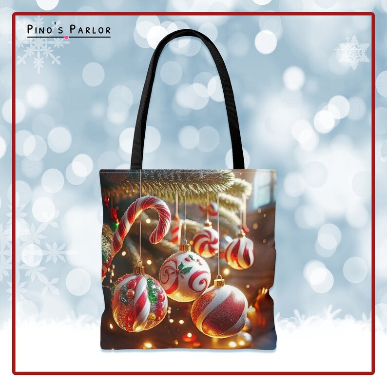 May include: A black tote bag with a Christmas tree design. The tree is decorated with red and white candy cane ornaments and red and white striped ornaments. The bag has a black handle.