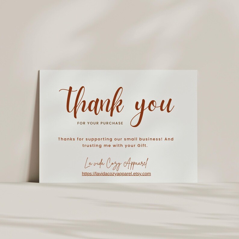 May include: A white card with the words "thank you" in a brown script font. The text "FOR YOUR PURCHASE" is below. Additional text reads "Thanks for supporting our small business! And trusting me with your Gift."
