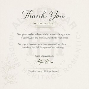 May include: A white thank you card featuring dark gray text that reads: Thank You for your purchase. Your piece has been thoughtfully created to bring a sense of quiet beauty and timeless comfort into your home. With appreciation, Alfre Briar.