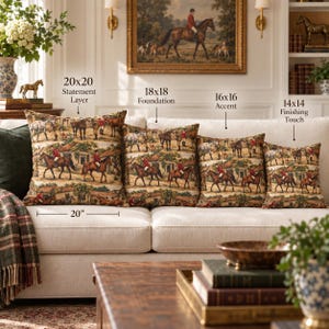 May include: Four square throw pillows featuring a repeating equestrian scene with riders in red jackets and horses. The pillows are labeled with sizes: 20x20 Statement Layer, 18x18 Foundation, 16x16 Accent, and 14x14 Finishing Touch, with a 20-inch measurement indicator.