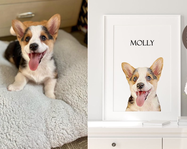 Op de afbeelding: Een witte ingelijste print met de naam "MOLLY" bovenaan en een aquarel van een corgi-hond met bruin, wit en zwart haar. De hond kijkt met zijn tong naar buiten naar de camera.