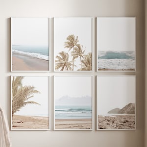May include: Set of six framed prints featuring beach scenes with palm trees, ocean waves, and sandy beaches. The prints are in a minimalist style with a muted color palette.