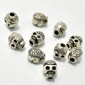 Antiqued Tibetan Silver Sugar Skull Spacer Beads: Floral Design, 9x7mm