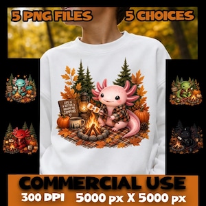 Puede incluir: Una sudadera blanca con el gráfico de un ajolote rosa con camisa de cuadros asando malvaviscos en una fogata. La escena incluye pinos, hojas de otoño, una linterna, una taza y un letrero que dice: "LIFE IS BETTER AROUND THE CAMPFIRE."
