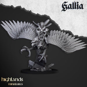 May include: A gray, detailed miniature of a king riding a griffin. The king is wearing a crown and armor, and the griffin has large wings and sharp claws. The miniature is set on a base with a stone texture.