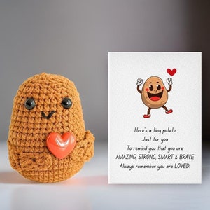 May include: A crocheted potato toy holding a red heart with a card that reads "Here's a tiny potato Just for you To remind you that you are AMAZING, STRONG, SMART & BRAVE Always remember you are LOVED."