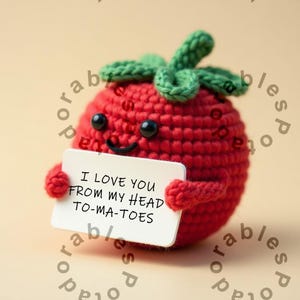 May include: A red crocheted tomato holding a white card that says "I love you from my head to-ma-toes".