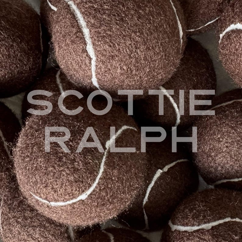 May include: A collection of dark brown tennis balls with a fuzzy texture and white seams. The text SCOTTIE RALPH is overlaid in a semi-transparent white font across the centre of the image, partially obscuring the brown tennis balls.