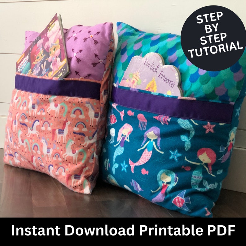 May include: Two pillow book pockets with a purple trim and a book inside each. The pillow on the left has a pink and white unicorn print. The pillow on the right has a blue and green mermaid print. The text "Step by Step Tutorial" is in a black circle at the top right of the image. The text "Instant Download Printable PDF" is at the bottom of the image.