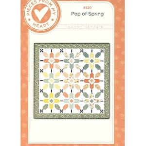 May include: A quilt pattern titled "Pop of Spring" by Sandy Gervais. The design features a floral pattern in shades of peach, yellow, green, and blue. The pattern is set against a white background with a decorative border and is packaged in a peach-colored cover.