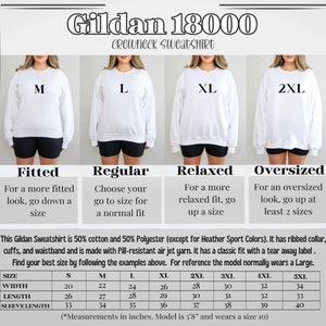 May include: A size chart for Gildan 18000 crewneck sweatshirts. The chart shows the measurements in inches for different sizes, from S to 5XL. The chart also includes information about the fit of the sweatshirt, such as fitted, regular, relaxed, and oversized.