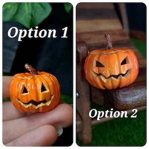 May include: Two miniature orange jack-o'-lantern pumpkins with carved triangular eyes and jagged mouths. Option 1 shows a pumpkin with a brown stem, while Option 2 displays a similar pumpkin with a slightly different carved expression and stem.