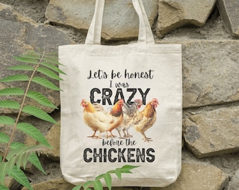 May include: A white tote bag with a black graphic that says "Let's be honest I was crazy before the chickens". The graphic also features a group of chickens.
