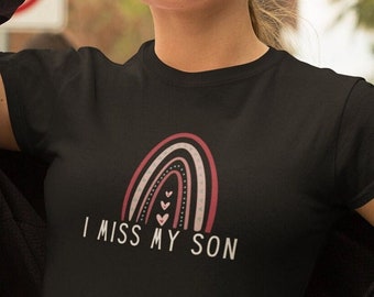 May include: Black t-shirt with a pink and white rainbow design and the text "I miss my son".