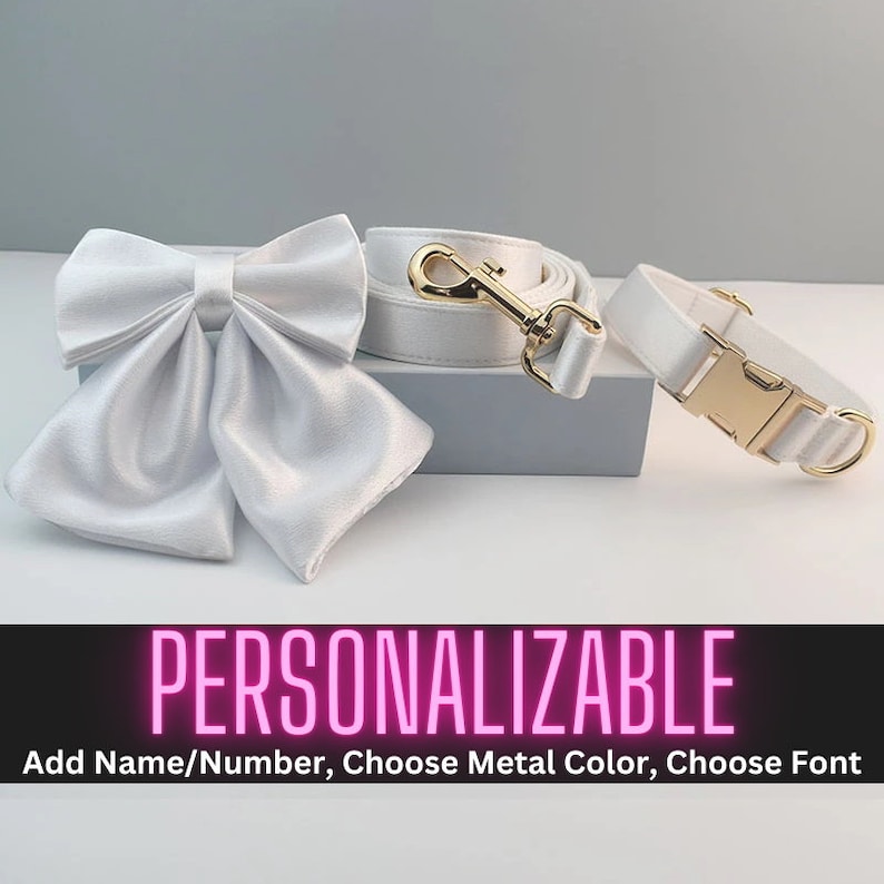 May include: White satin dog bow tie and matching leash and collar set with gold hardware.  Personalizable with name, number, metal color, and font.