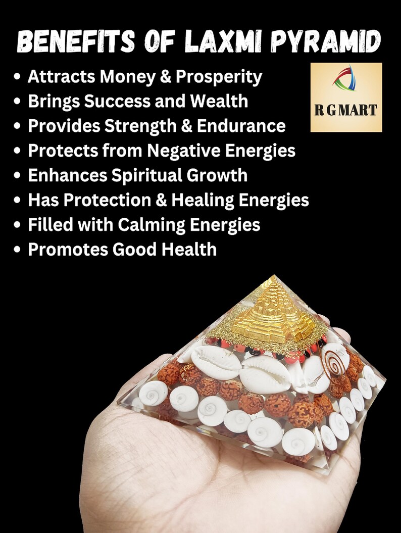 May include: A clear glass pyramid filled with white seashells, red beads, and a gold-colored statue of a deity. The pyramid is being held in a hand. The text "BENEFITS OF LAXMI PYRAMID" and "RG MART" are visible in the image.