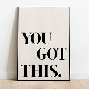 May include: A black framed poster with a white background and the text "YOU GOT THIS." in black bold font.
