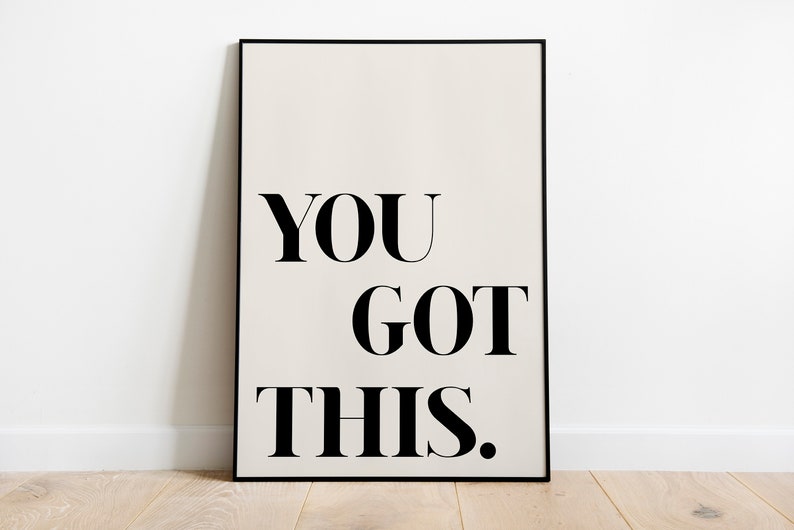 May include: A black framed poster with a white background and the text "YOU GOT THIS." in black bold font.