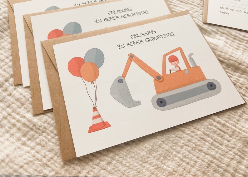 May include: A brown card with a white background and a cartoon illustration of a construction worker driving a yellow excavator. The card has the text "Einladung zu meinem Geburtstag" which translates to "Invitation to my birthday". There are also three balloons and a traffic cone on the card.
