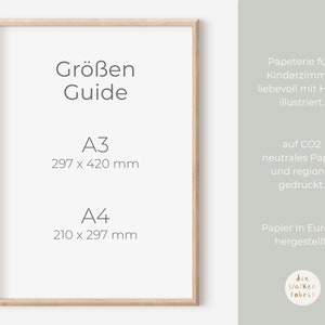 May include: A wooden frame with a white background and text that reads "Gr&ouml;&szlig;en Guide" and lists the sizes A3 (297 x 420 mm) and A4 (210 x 297 mm). The text also reads "Papeterie f&uuml;rs Kinderzimmer liebevoll mit Hand illustriert." and "auf CO2 neutrales Papier und regional gedruckt." and "Papier in Europa hergestellt." and "die Wolken Fabrik".