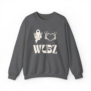May include: Dark gray sweatshirt with a white ghost graphic, skeleton hands forming a heart, and the word "WUBZ" in a retro font. The sweatshirt is a casual, comfortable style.