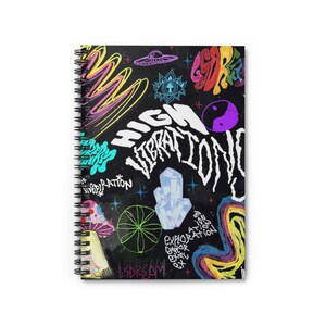 May include: A black spiral notebook with a colorful, psychedelic design. The notebook features a variety of images, including a UFO, crystals, mushrooms, and a yin-yang symbol. The text "HIGH VIBRATIONS" is written in large, bold letters.