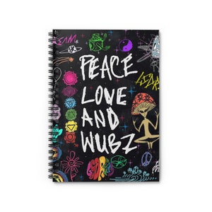 May include: A black spiral notebook with a colorful design featuring the text "Peace Love and Wubz". The design includes a meditating alien, a flower, a yin yang symbol, and other psychedelic imagery.