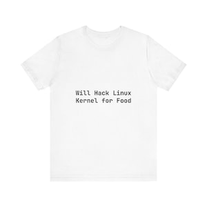 May include: White t-shirt with the text "Will Hack Linux Kernel for Food" in black, centered on the front. The shirt has a crew neck and short sleeves, made of a soft, likely cotton material.