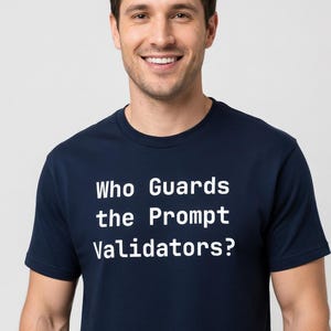 May include: A navy blue t-shirt with the white text "Who Guards the Prompt Validators?" The shirt is made of a soft material and is being worn by a person. The person is smiling.