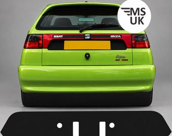 May include: A lime green SEAT Ibiza Cupra 16V Turbo hatchback viewed from the rear. The car features a red horizontal trim panel with the text SEAT and IBIZA, a yellow license plate, a rear wiper, and a black bumper. A black graphic overlay is below.