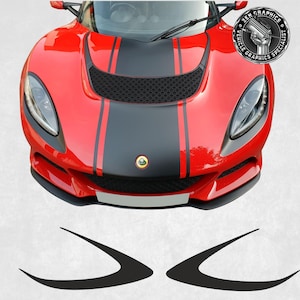 May include: A red sports car with a black hood and racing stripes. The hood features a black center section with red stripes and a Lotus emblem. Includes two black decals. The image also has a logo that says "ZEN GRAPHICS VEHICLE GRAPHICS SPECIALIST."