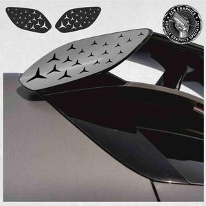 May include: A set of three black vinyl car decals featuring a pattern of small white triangles. The decals are designed to be applied to the rear spoiler of a car.