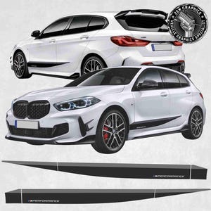 May include: White hatchback car with black detailing and black alloy wheels. The image shows the front and side views of the car, plus two black side panel decals with "M PERFORMANCE" text. The car has a sporty design.
