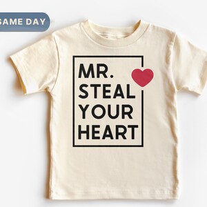 a t - shirt with the words mr steal your heart on it