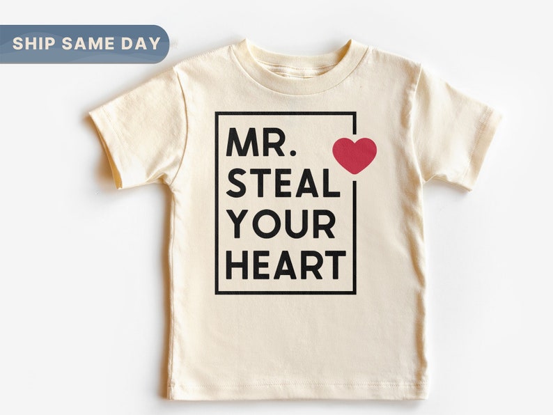 a t - shirt with the words mr steal your heart on it