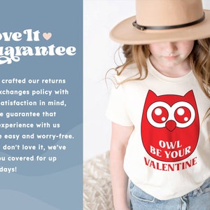 a young girl wearing a t - shirt with an owl on it